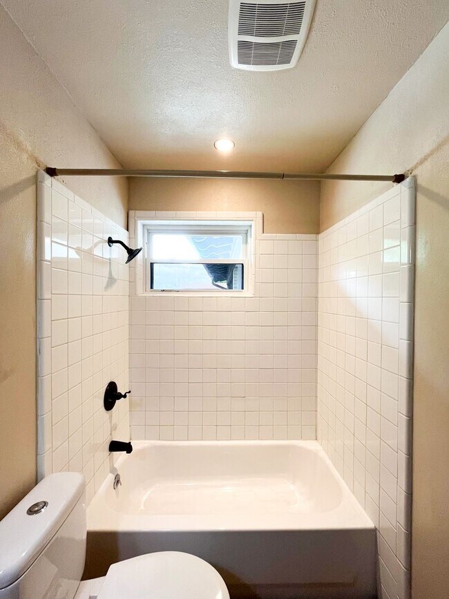 Building Photo - Available Now!!!! Gorgeous 3 bedroom, 2 bath, 2 car garage home. Beautiful wood look flooring. Sp...