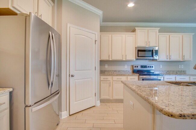 Building Photo - Spacious 4BR Pool Home with Modern Upgrade...