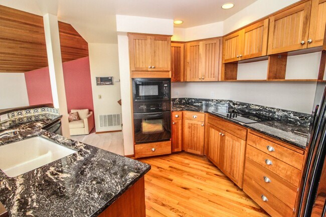 Building Photo - Spacious 4-Bedroom Home with Stunning Lake...