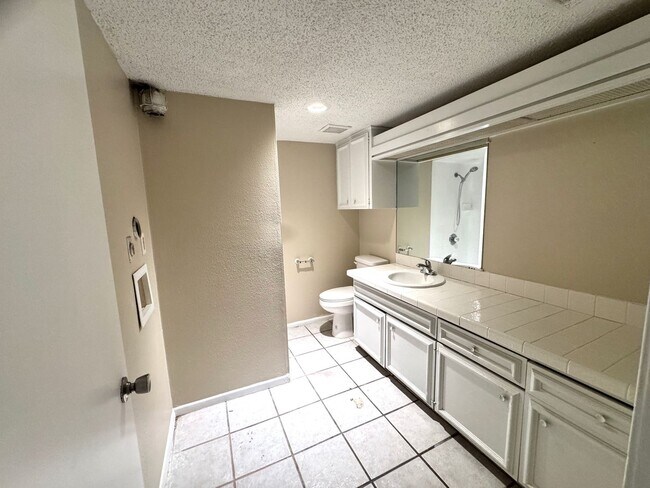 Building Photo - Single-level living on ground floor  |  Fresh paint (July 2026)  |  2 carports  |  Community Pool...