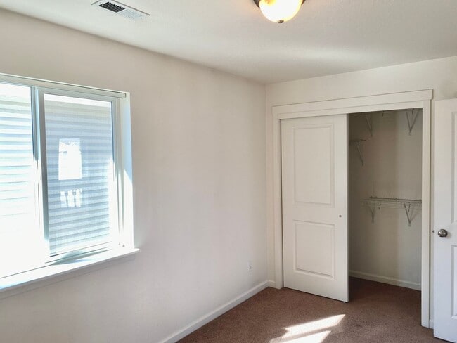 Building Photo - Townhouse Style Home with 3 Bedrooms, 2.5 Bathrooms, and a 2-Car Attached Garage Available in Coe...