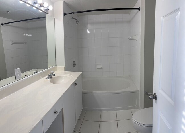 Building Photo - Up to 2 Months Free! Spacious 2/2 Corner Lake View Unit in Coral Springs!