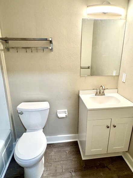 New vanity, light and toilet. - 7100 Thomas Blvd