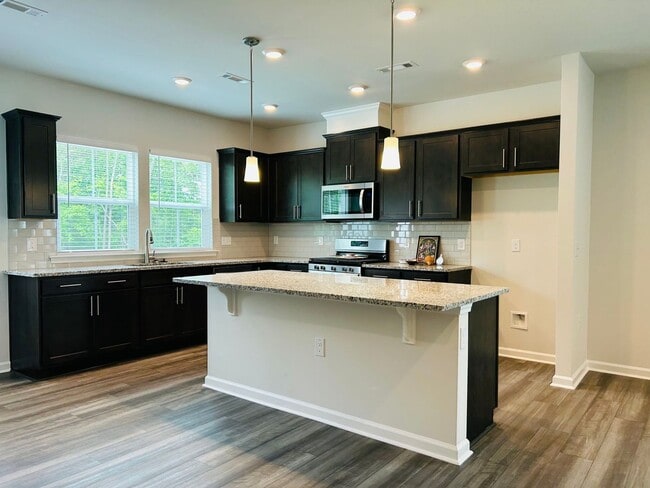 Building Photo - Applications pending! Stunning new end-unit 3 bedroom 2.5 bath townhouse in N High Point with att...