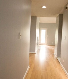 Building Photo - Spacious & Private Move In Ready Townhome ...