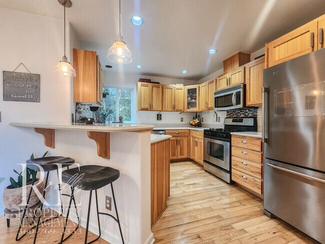 Building Photo - Light-Filled View Home with Vaulted Ceilings & Warm Wood Finishes