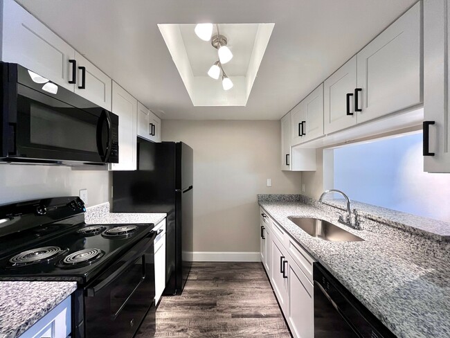 Step into a contemporary kitchen space, perfect for culinary enthusiasts. - Inertio Apartments