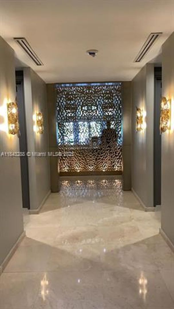 Building Photo - 10275 Collins Ave