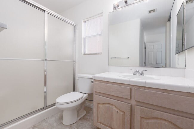 Building Photo - 3-bedroom 2-bathroom town house with a double car garage, freshly painted and new carpet.