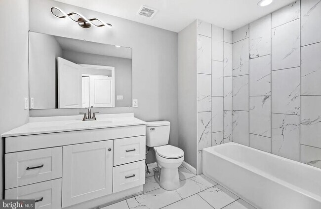 Building Photo - East District 3 BR/3.5 BA End Row Home w-Private Parking