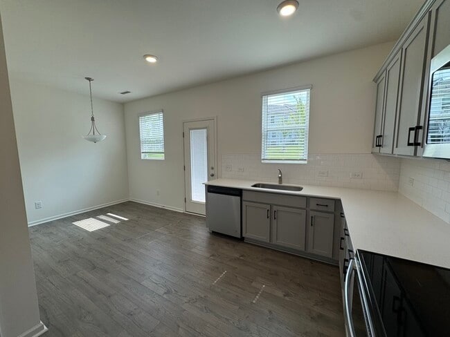 Building Photo - Corner townhome with three bedrooms 2 1/2 ...