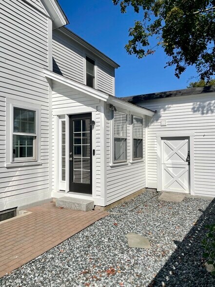 Close up of side yard, mudroom entrance, and shed. - 20 Chapel St