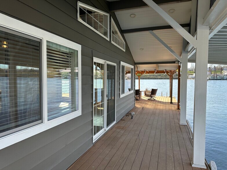 HUGE deck in front of the house and big covered deck offer tons of outdoor space. - 1879 N Jantzen Ave