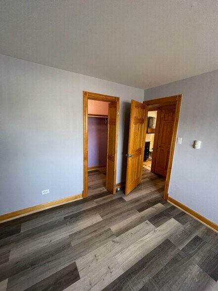 MASTER BEDROOM ENTRY VIEW WITH WALKING CLOSET - 7328 W 85th Plz