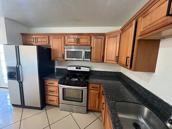 Building Photo - Move-In Ready Beauty with Granite Kitchen, Stainless Steel Appliances & Expansive Backyard