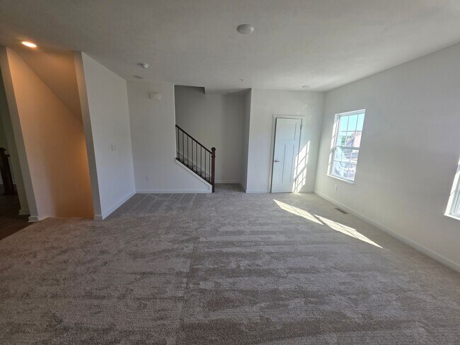 Building Photo - Brand-new townhome with modern finishes, flexible living space, and low-maintenance living.