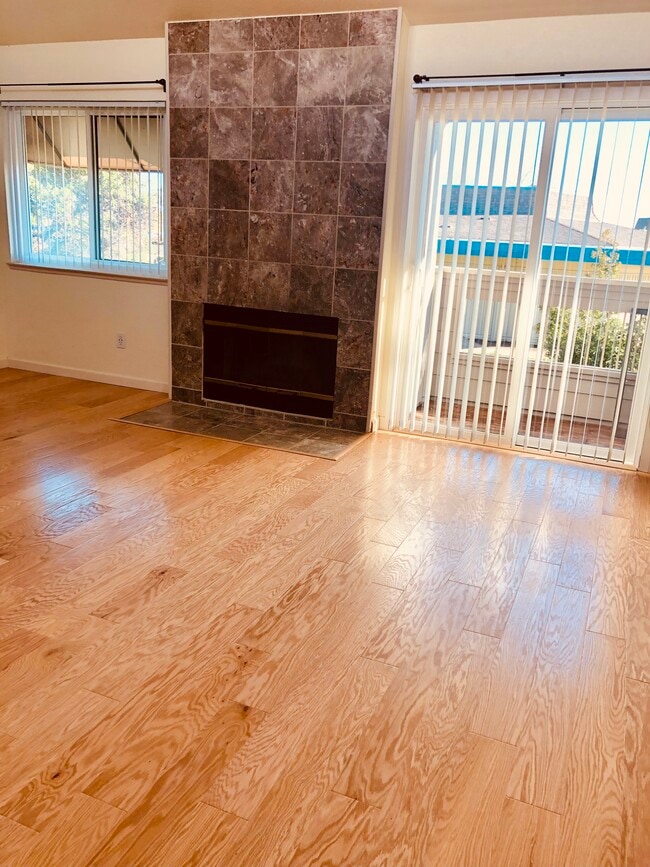 living room with wood burning fireplce - 246 Bonita Ln