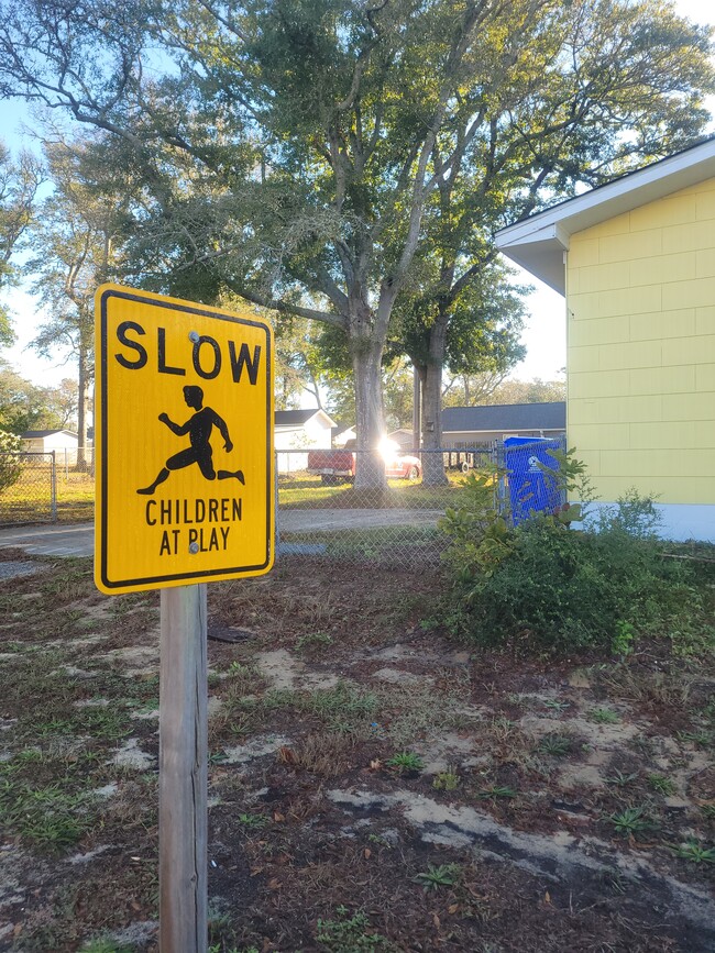 Children at play sign - 702 E Oak Island Dr