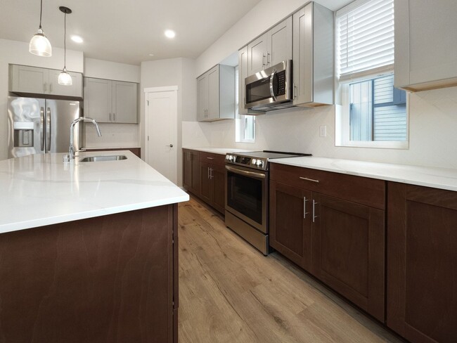 Building Photo - Newly Built 4-Bedroom Townhome with Modern...