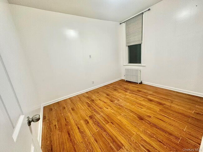Building Photo - 18-17 125th St