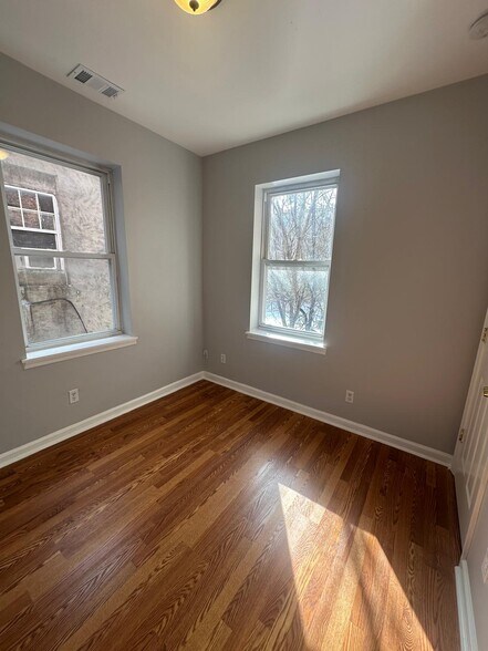 Bedroom 2 windows provide great lighting - 1426 Madison Ave