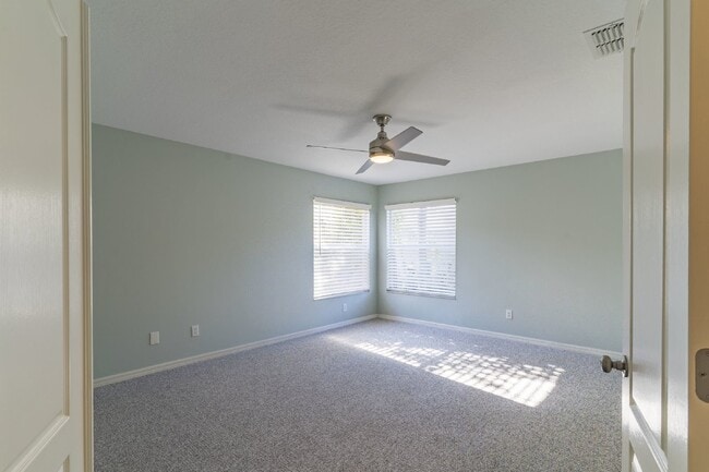 Building Photo - Beautiful 4/2 home Located on a tree lined street in the gate of country club community of the Hu...