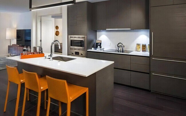 Full Wall Kitchen with Upper and Lower Cabinets and Under-Cabinet Lighting - Pike Motorworks