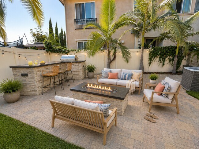 Large patio area with built in firepit and outdoor kitchen area - 12035 Millennium Park Ct