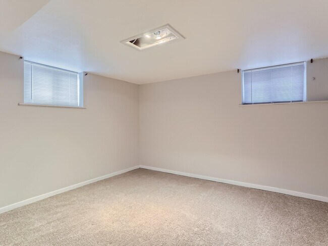 Building Photo - Evolve Real Estate: Available 8/8/26 Brick Tudor with Large Yard and Finished Basement!