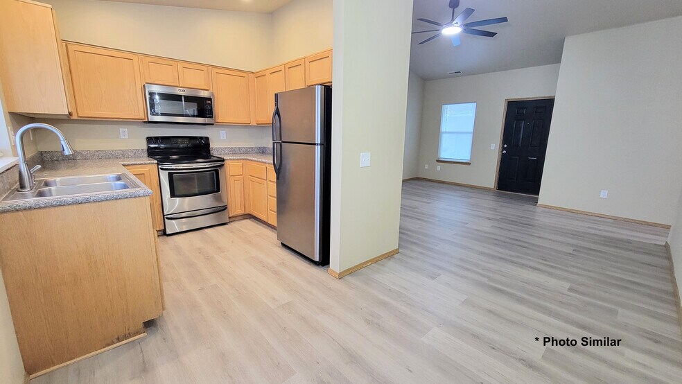 Kitchen, dining and living room area (view from dining) - 205 S Dewey Ave