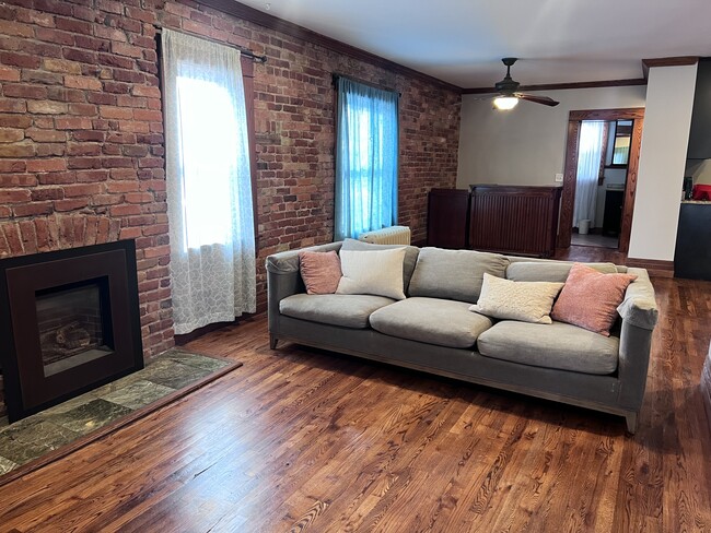 Living room with fireplace - 4301 Tejon St