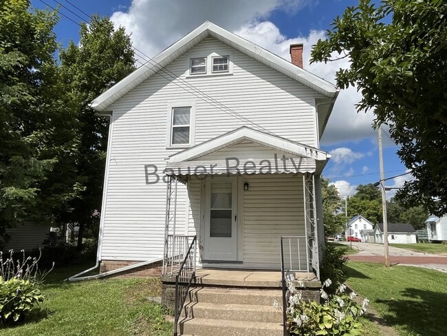 Building Photo - Three bedroom home with two car, detached garage!