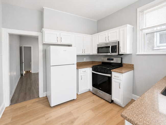 Building Photo - Home with Modern Kitchen, Finished Basement & Backyard Deck