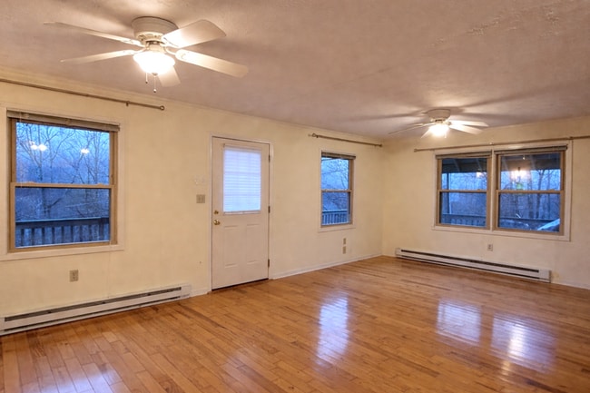 Building Photo - Light-Filled 3BR Home with Wraparound Deck, Convenient to Town