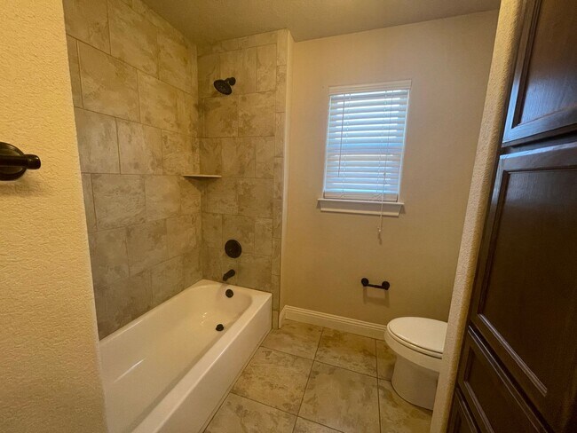 Building Photo - Beautiful Benbrook 3B/2.5B Townhome ((Stainless Steel Appliance Package)) Dazzling wood-like tile...