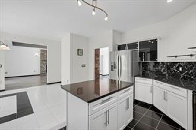 Building Photo - Spacious 5-Bed Walkout Home with Over 3,50...