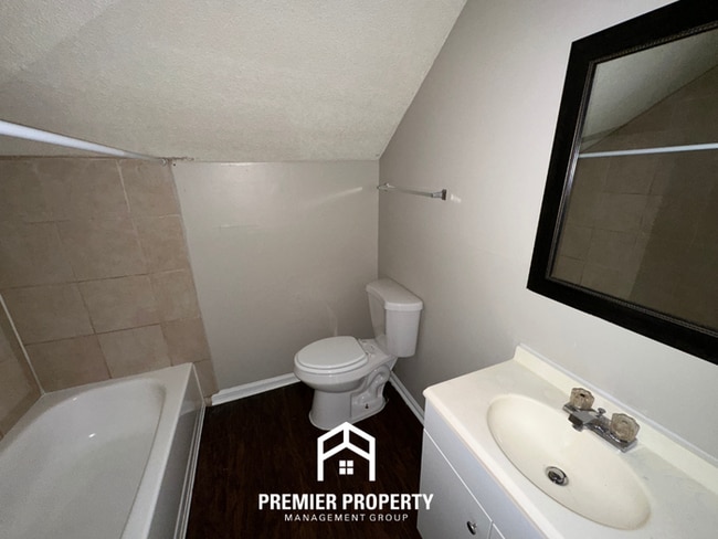 Building Photo - Beautiful 3BR/2BA Near Southwind | Soaring Vaulted Ceilings, Fireplace & Fenced Yard