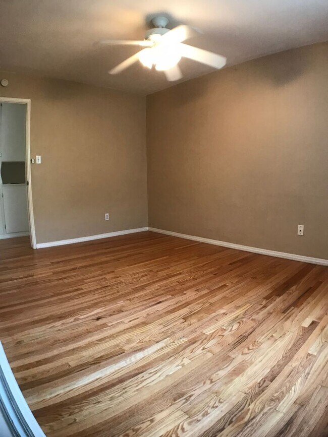 Building Photo - BEAUTIFUL WOOD FLOORS IN THIS 5 BED 2 BATHROOM HOUSE- LARGE DOGS OK