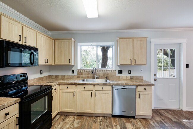 Building Photo - Modern Elegance: 3-Bedroom Townhome with Wood Flooring, Shaded Deck, and Inclusive Amenities