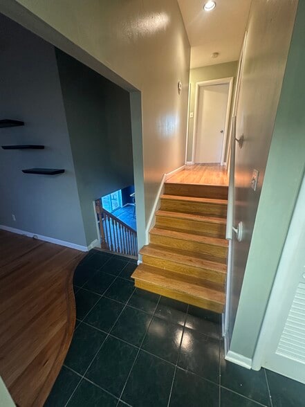 Stairs to lower and upper levels - 9030 Old Bonhomme Rd