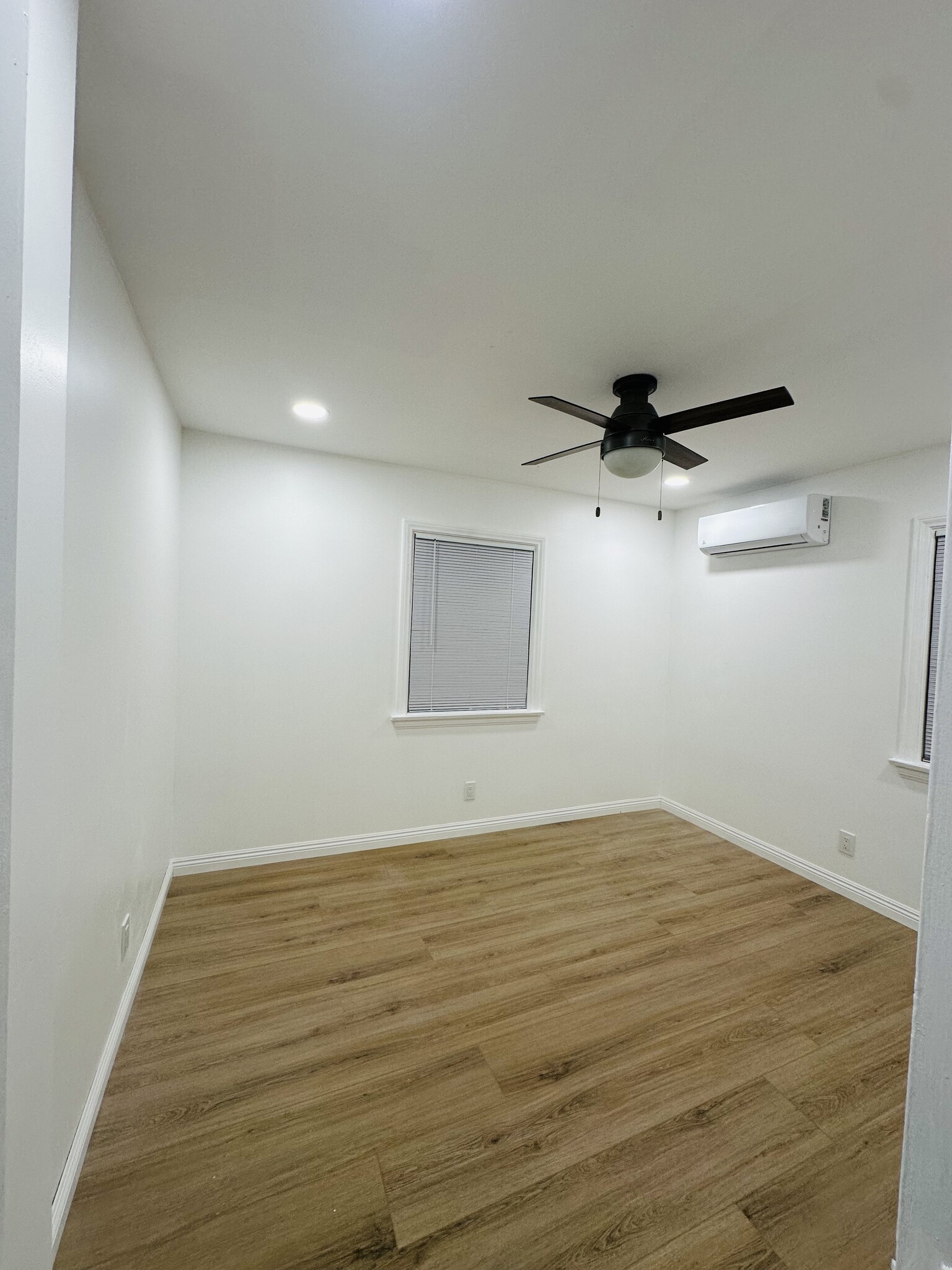 Bedroom: large closet, vinyl plank flooring, mini split m, ceiling fan - 1537 Freeman Ave