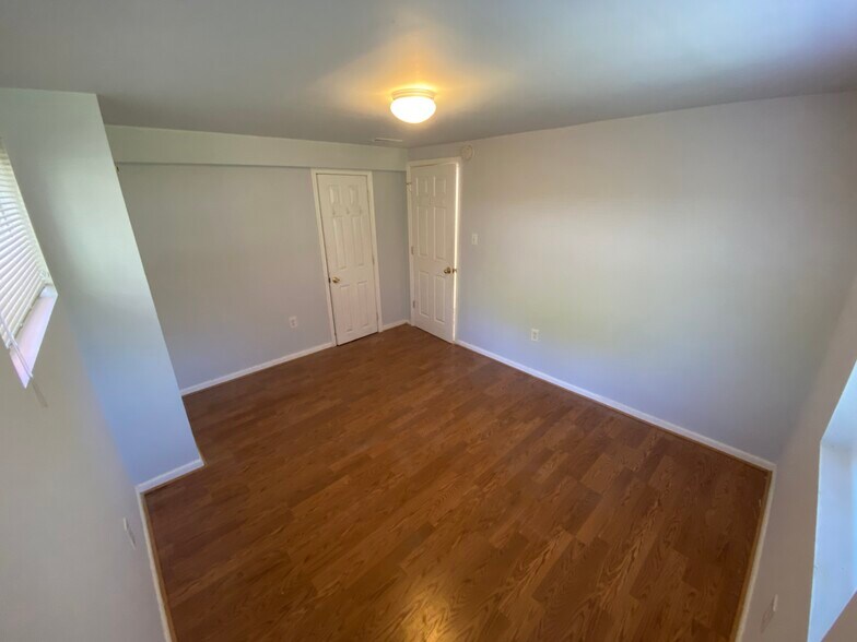 1st Bedroom - Facing closet and door - 9110 Drake Pl