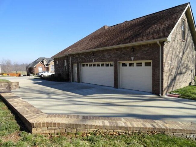 Building Photo - Luxury Living! Beautiful Brick Home in Sango with 3 car garage.