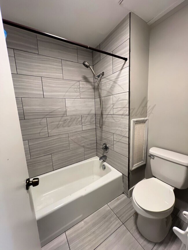 Building Photo - One Bedroom Condo, FIRST FLOOR, Assigned P...