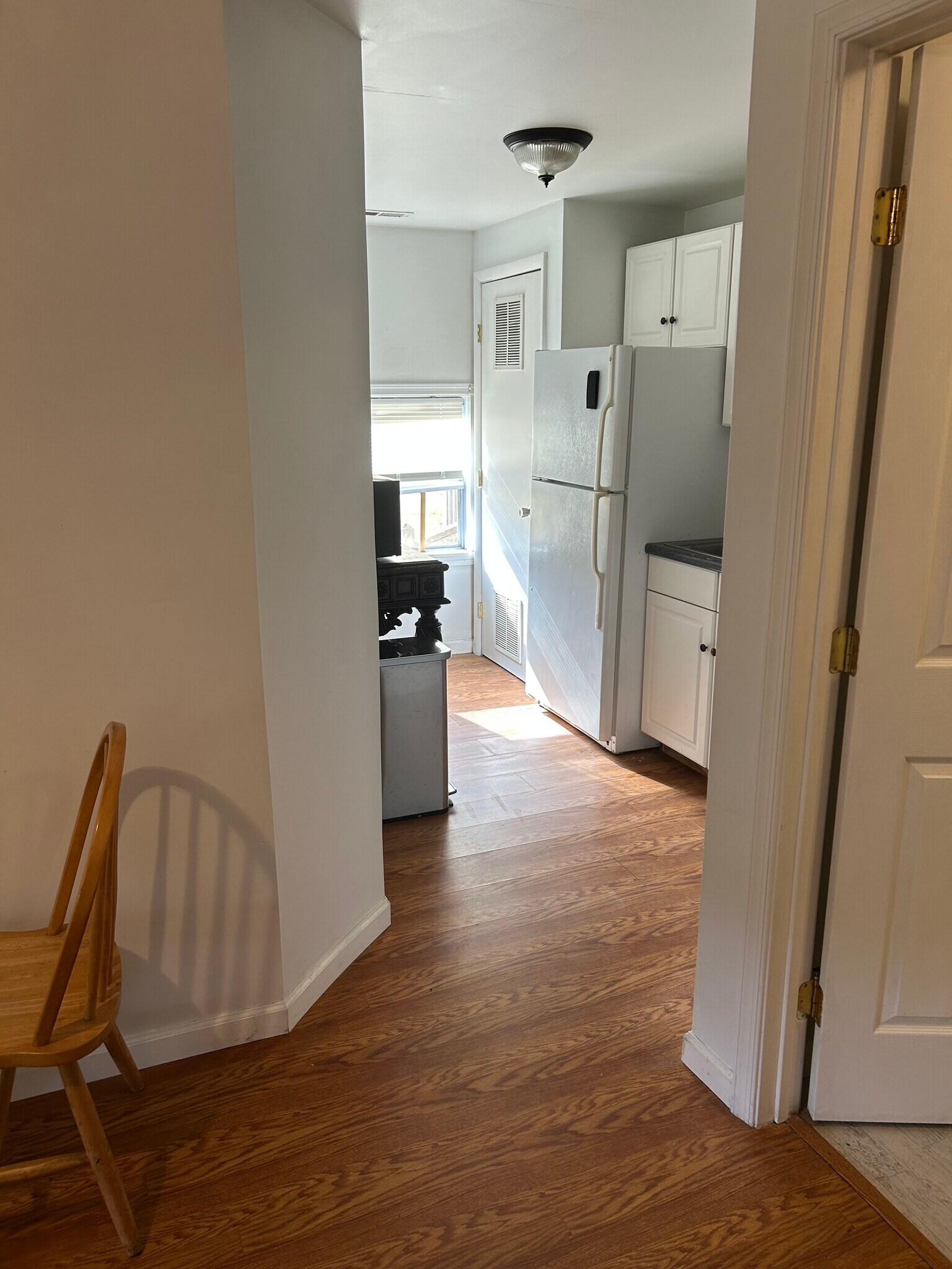 Standing in living room looking into kitchen - 26908 Plantation Rd