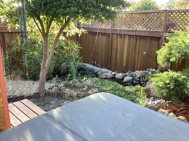 Building Photo - Look No Further, this home has it all- Hot Tub, Sauna, EV Charger, Solar, KOI Pond & More