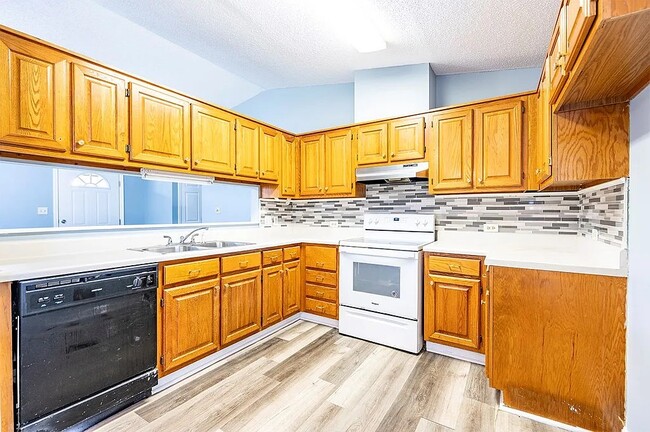 Kitchen (view of front door) - 1313 Montego Ct