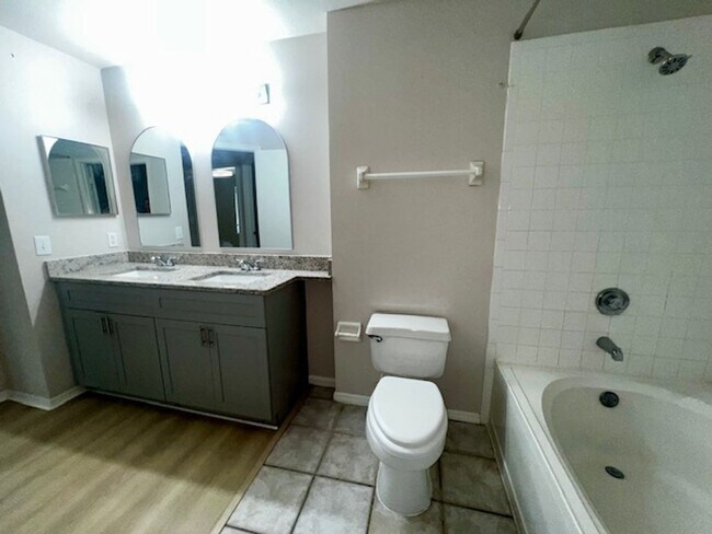 Building Photo - NEW-Remodeled bathroom & kitchen! NEW VINYL PLANK flooring & fresh paint! 2 bedroom 1 bath condo ...