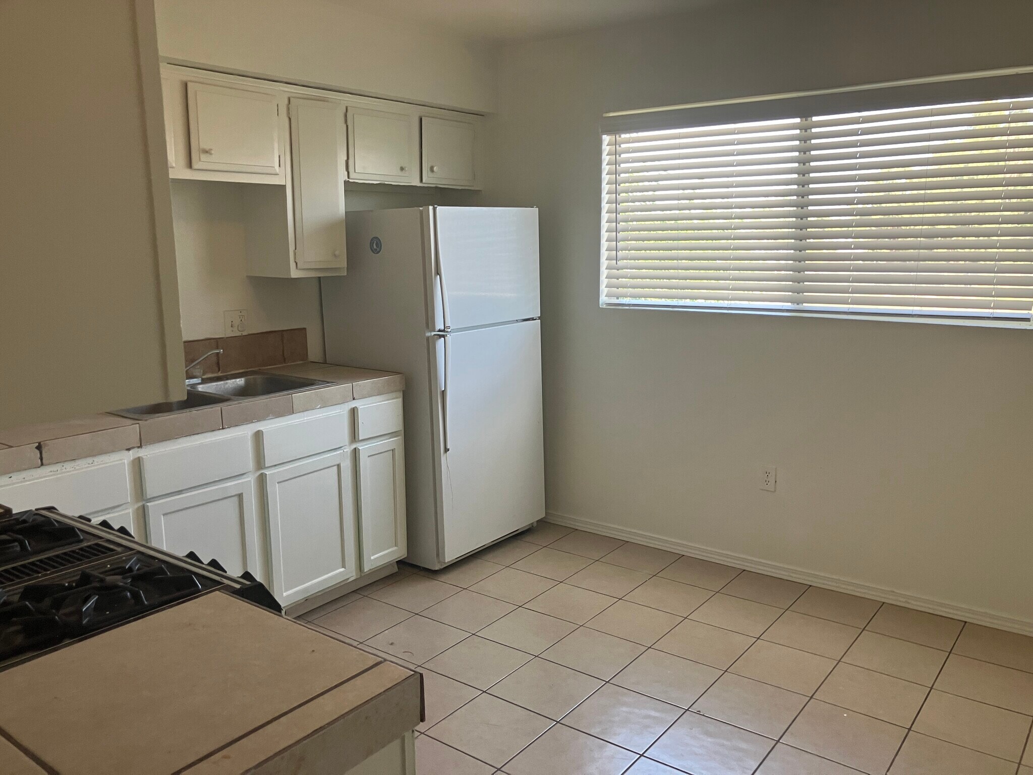 Kitchen cupboard space and refrigerator - 8405 Trumbull Ave SE