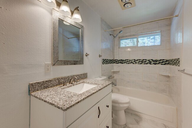 Building Photo - Spacious 4-Bedroom Home with Fireplace, Fenced Yard, and 2-Car Garage